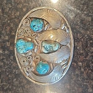 Turquoise and silver belt buckle